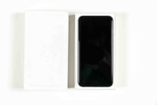 istock Unboxing new smartphone on white background 911192174