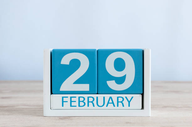 istock February 29th. Cube calendar for february 29 on wooden workplace with empty space For text. Leap year, intercalary day 911222156