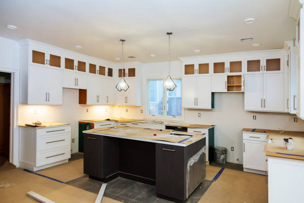 istock Installing new induction hob in modern kitchen kitchen Installation of kitchen cabinet. 911225762