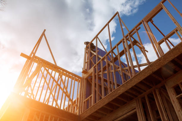 builder at work with wooden roof construction wood building frame - construction frame construction frame house imagens e fotografias de stock