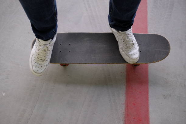 istock boy legs on the skateboard 911228624