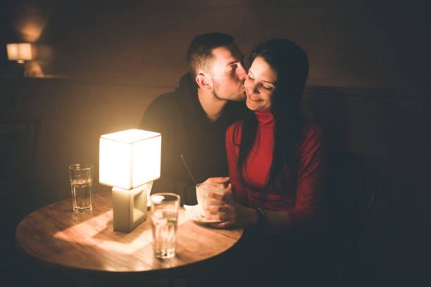 istock Couple at a coffee place on winter night. 911229144