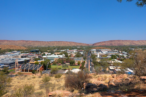 Alice Springs, Australia - 22nd September, 2017:Road through the township Alice Springs in the Northern Territory of Australia, viewed from Anzac Hill showing the arid outlying areas.