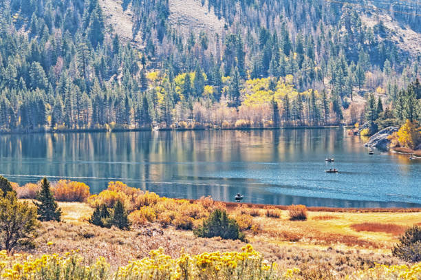 This beautiful view is from the roadway of the June Lake Loop the travels around the edge of this lake a part of Mammoth Lakes Recreation Area. The boaters have a reasonable sized lake for their boating and fishing endeavors.