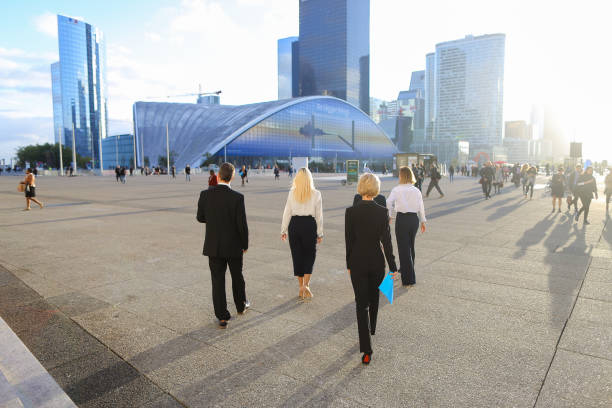 istock Financial team members passing with tablet, cases and looking at 911252868