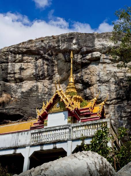 istock Wat Phraphutthachai Temple By The Cliff , Thailand 911263384