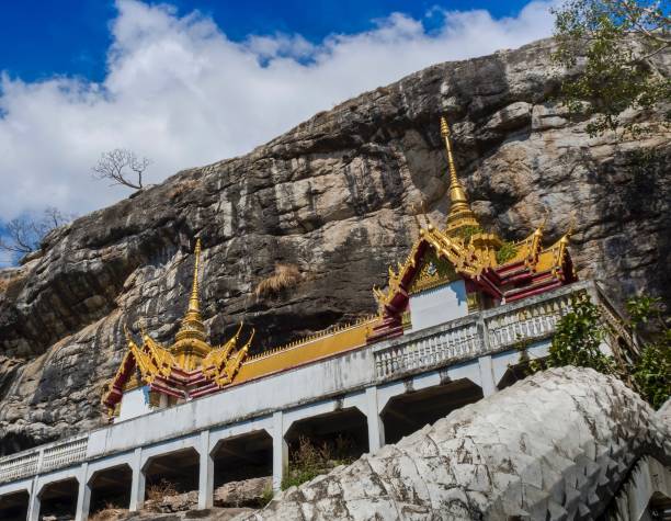 istock Wat Phraphutthachai Temple By The Cliff , Thailand 911263468