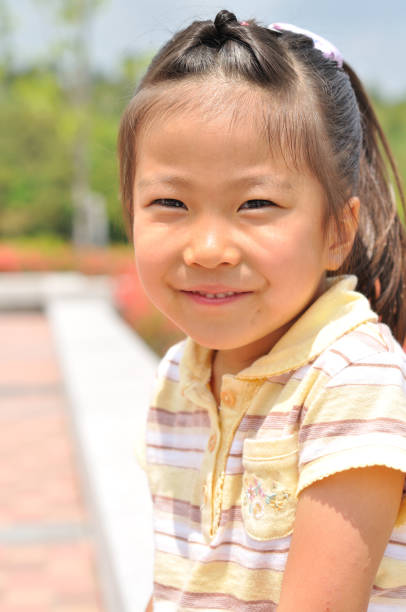 istock Girl's smiling in the park 911267060