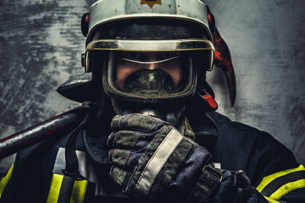 istock Portrait of firefighter on helmet 911267606