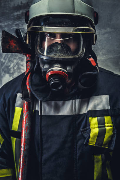 istock Rescue firefighter in safe helmet and uniform. 911267776