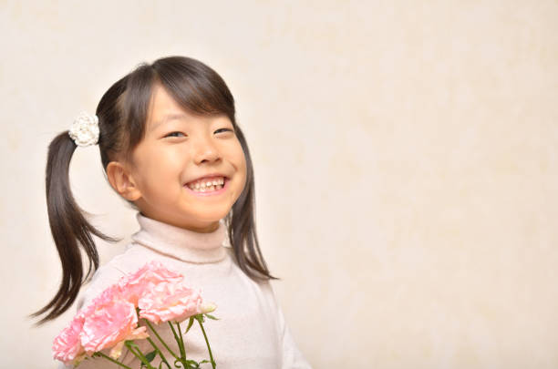 istock Girl and Carnation 911270344