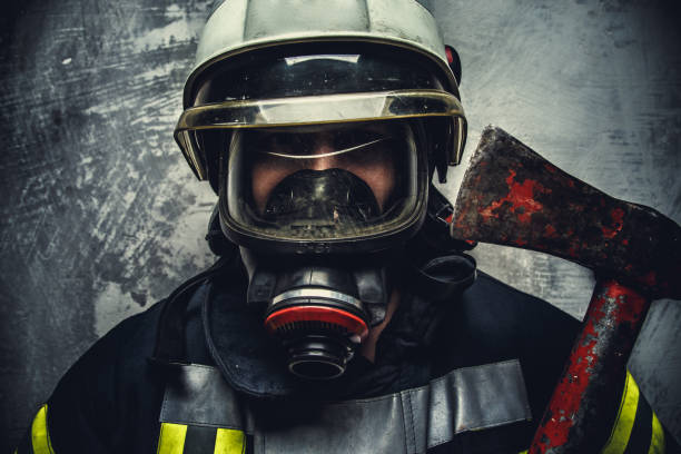 istock Portrait of firefighter in white helmet 911270584