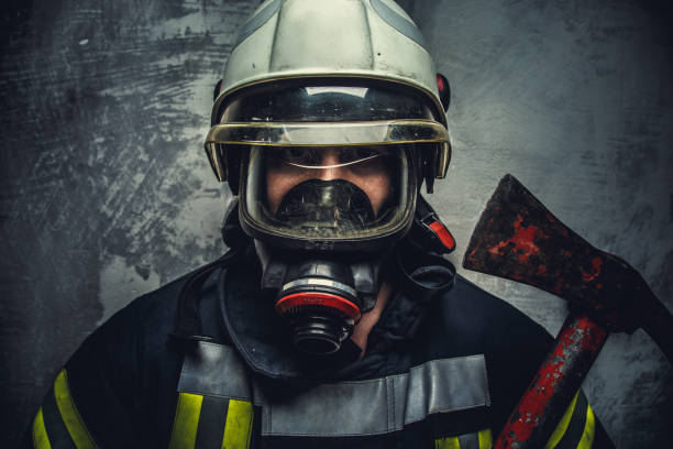 istock Portrait of firefighter in white helmet 911274122