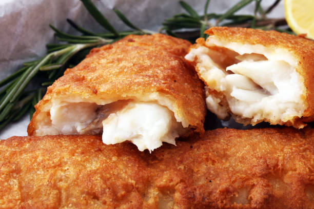 istock traditional British fish and chips with potato and lemon 911278886