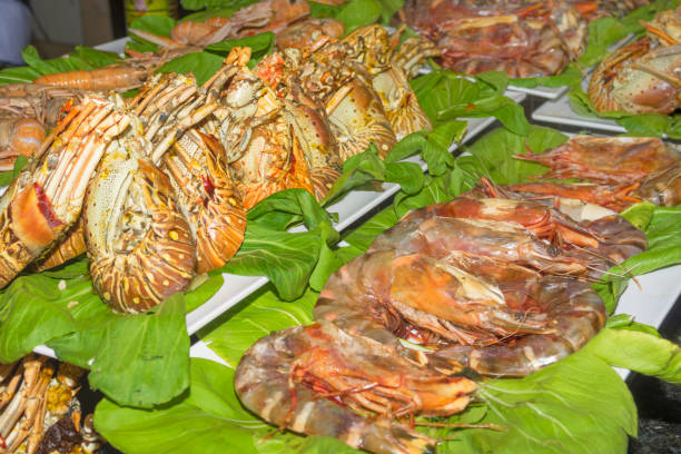 istock Freshly cooked royal prawns on green lettuce leaves 911286948