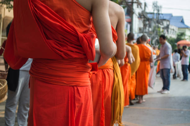 istock Monks Alms-round or receive food offerings moment. 911287100