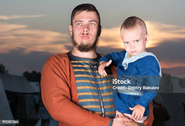Horizontal Portrait Of A Slavic Man With A Baby In Historical Costume Vintage Clothing Stock Photo - Download Image Now