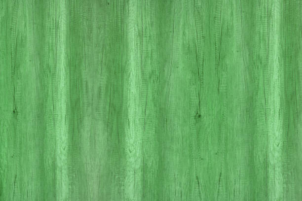 istock Wood texture with natural patterns, green wooden texture. 911287414