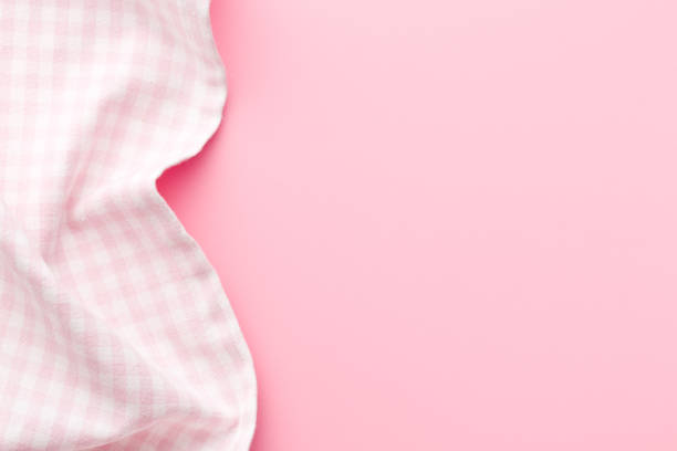 top view of pink checkered napkin on pink table