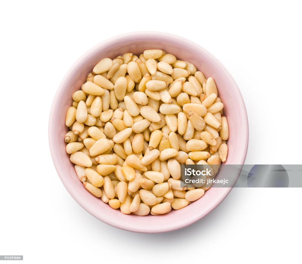 pine nuts pine nuts in bowl on white background Close-up Stock Photo