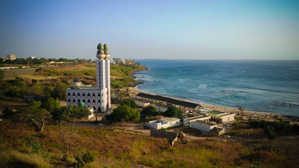 view to Mosque of the Divinity at sunset, Dakar, Senegal view to Mosque of the Divinity at sunset in Dakar, Senegal senegal beach stock pictures, royalty-free photos & images