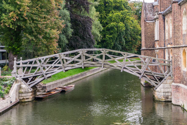 River Cam, Queens college, Cambridge in the depths of Autumn. Punting on the river Cam and the Mathematical Bridge, Queens college, Cambridge in the depths of Autumn. lethbridge alberta stock pictures, royalty-free photos & images