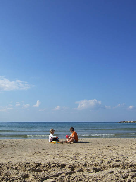 girls playing in the sand  burrow somerset stock pictures, royalty-free photos & images