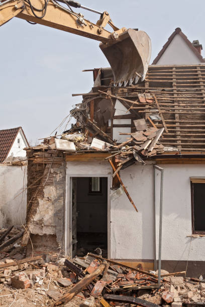 istock A large track hoe excavator tearing down an old house 911301956