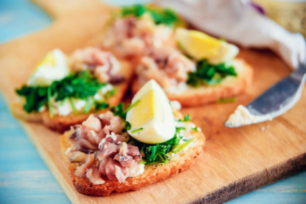 istock bruschetta with tuna and spinach on toast of white bread, with egg 911305984