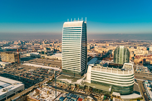 Wide drone shot of corporate financial business district skyscraper tower. The scene takes place near financial and industrial district near or short after sunset outdoors in the city of Sofia, Bulgaria (Eastern Europe). The footage is taken with DJI Phantom 4 Pro video drone / quadcopter.
