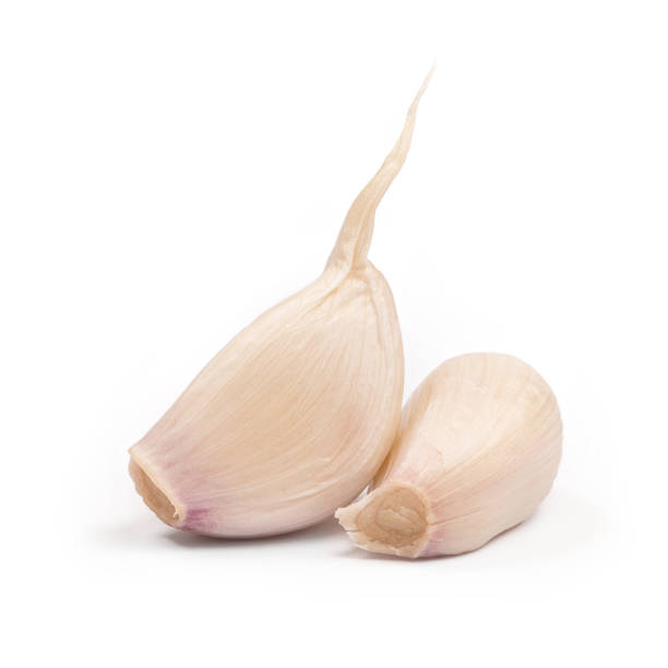 istock Garlic cloves close up isolated on the white background 911316982
