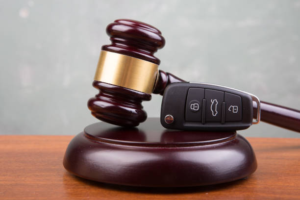 Car auction concept - gavel and car key on the wooden desk stock photo