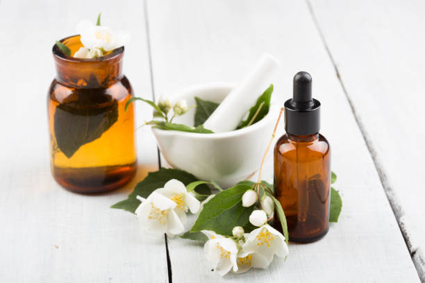 istock Spa concept - making essential oil with jasmine flowers 911318150
