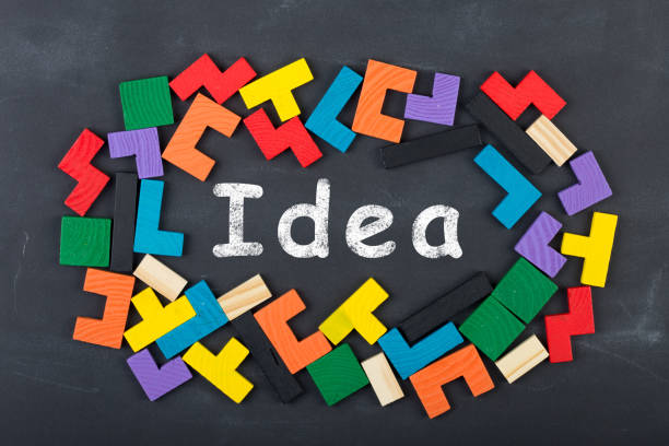 istock Business creative idea concept - inscription and jigsaw blocks on the blackboard 911318442