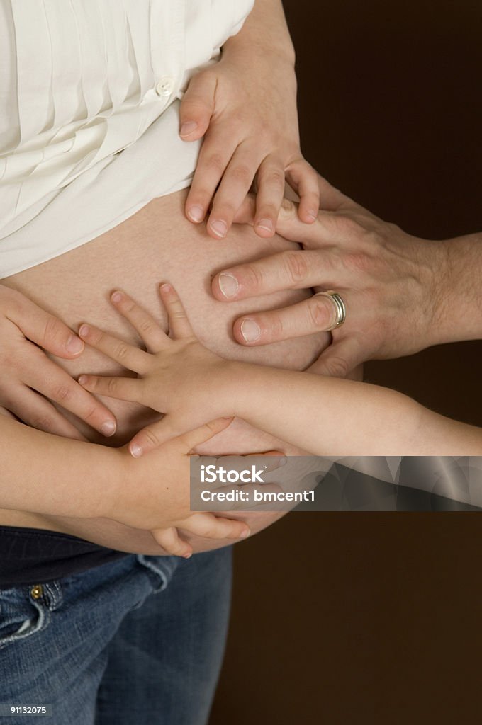Familia y nueva incorporación - Foto de stock de Abdomen humano libre de derechos