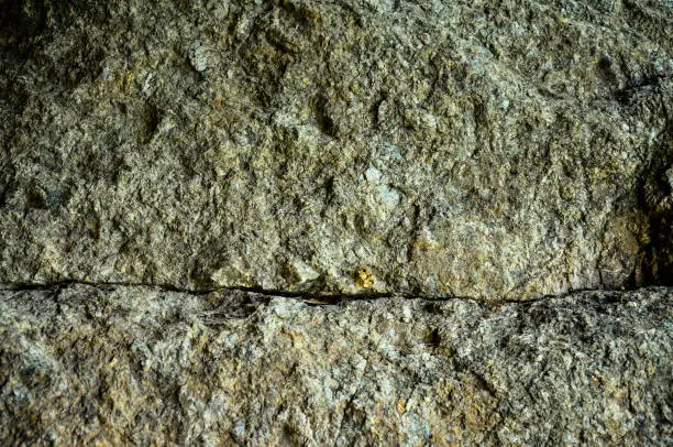 Photo of close up of rough and cracked rock surface