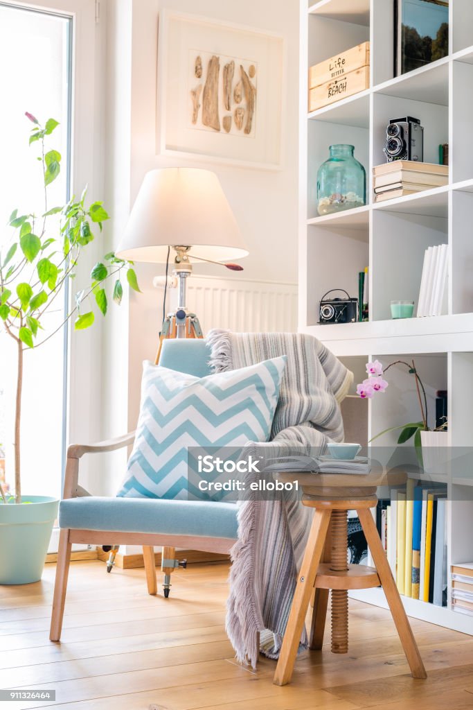 Cozy reading corner with armchair. Reading Stock Photo