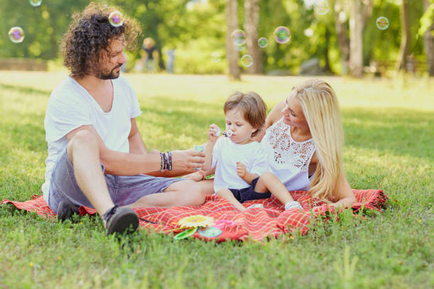 istock Happy family in the park 911326926