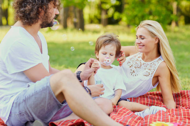 istock Happy family in the park 911328508