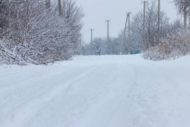 istock Snowy rural street during snowfall 911330186