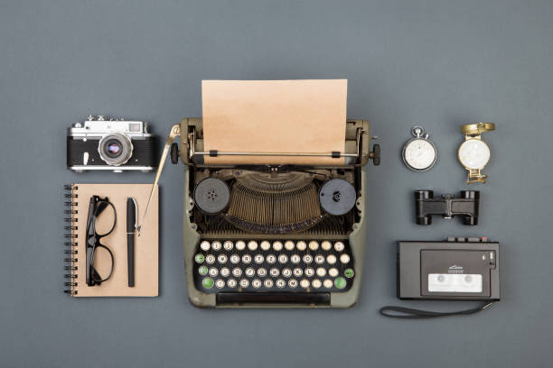 istock Journalist or private detective workplace - typewriter, camera, recorder and other stuff 911330242