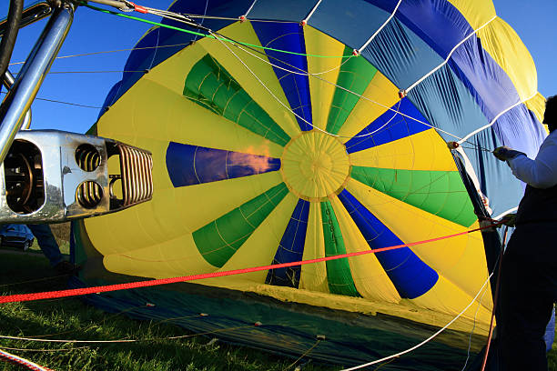 istock ballooning - blowing up the balloon with hot air 91133077