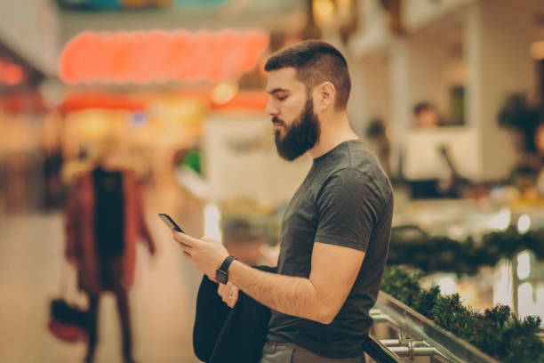 istock Handsome man at shopping mall 911333752