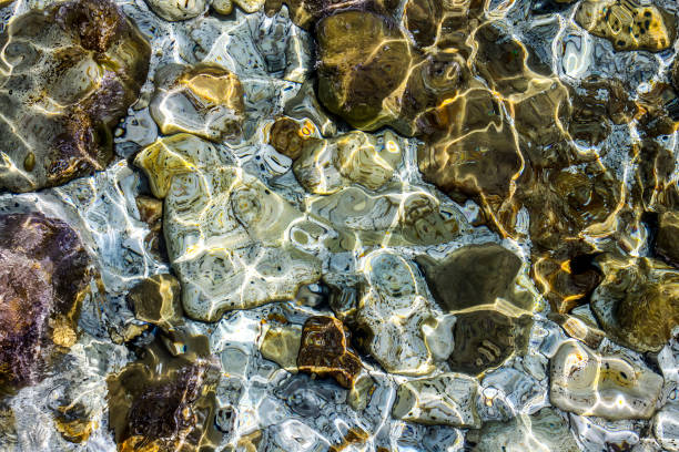 istock Colorful stones under the sea 911340516