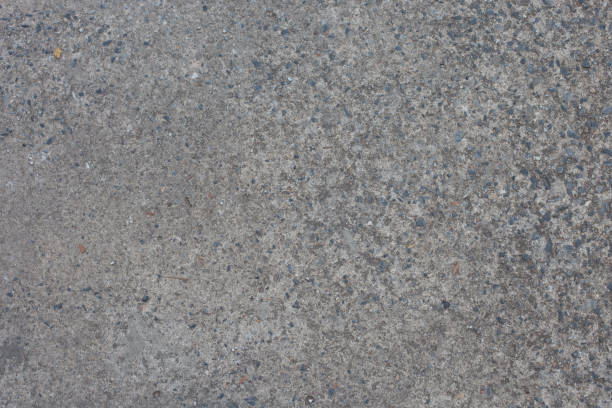 istock Concrete floor with rocks in the concrete 911344446