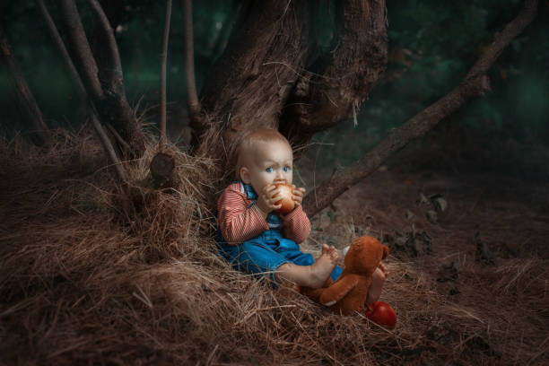 istock Baby girl eating an apple. 911345280
