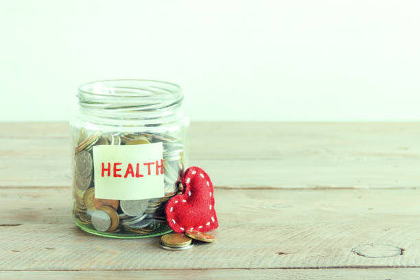 istock Coins in jar for Health 911348656