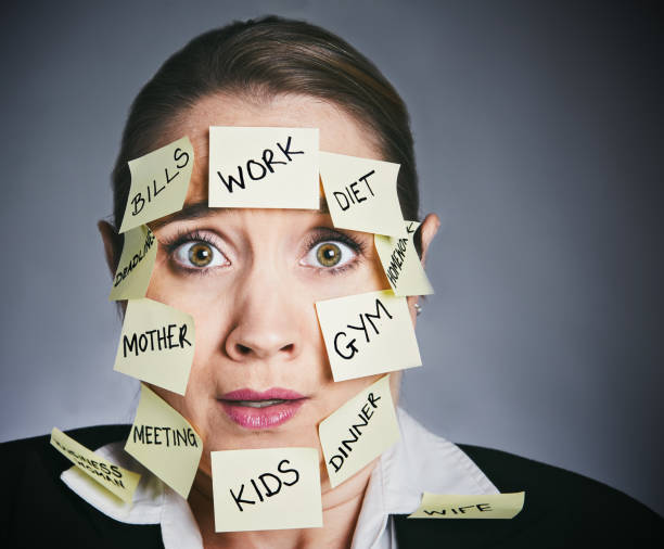 istock Multi-tasking woman looks desperate 911349170
