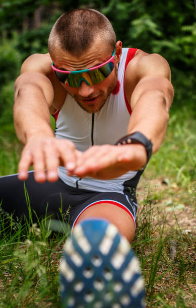 istock Male in sportswear doing body extension 911351314