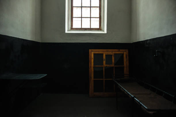 istock Dark vintage jail room 911358342